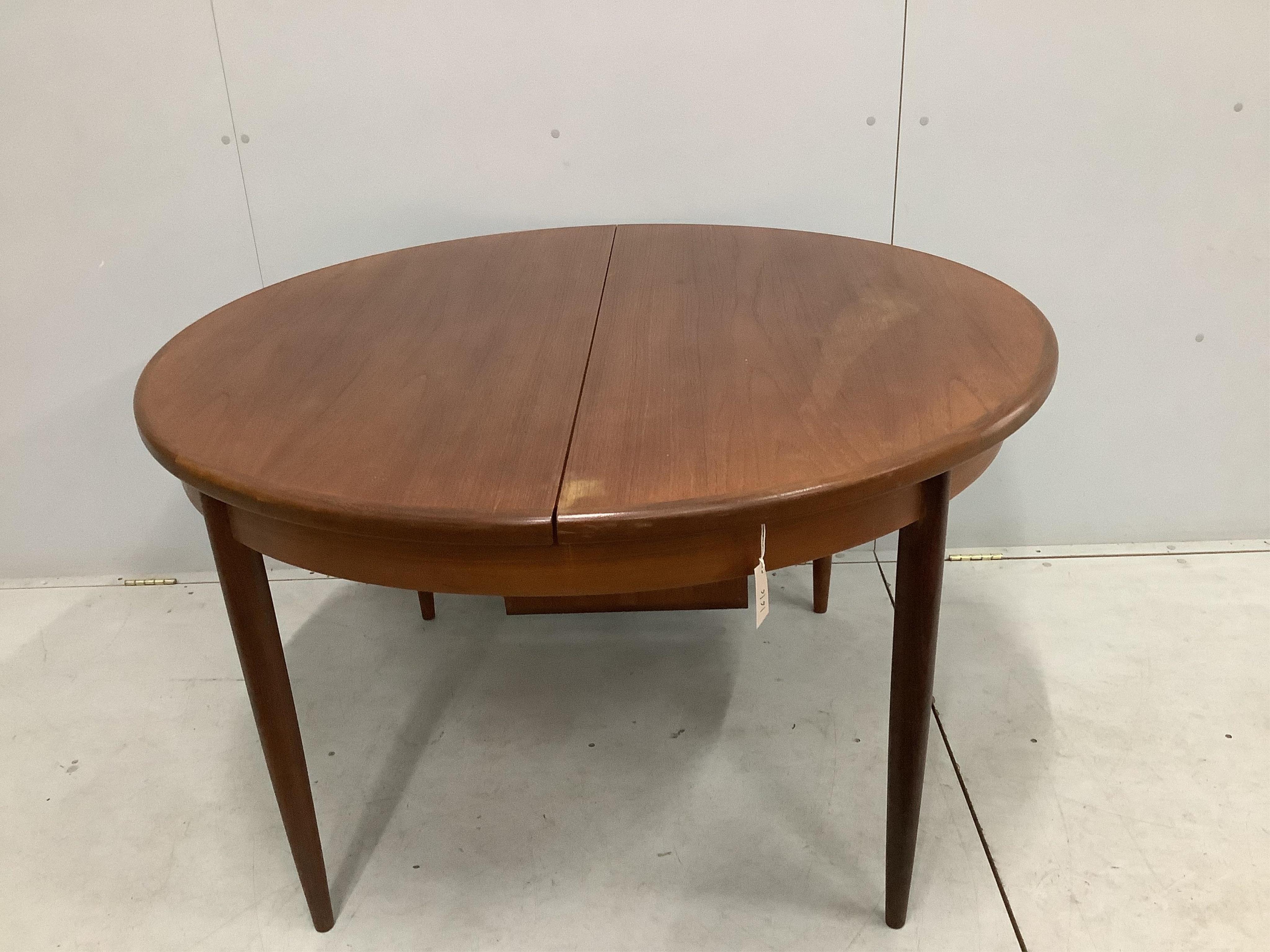 A G plan extending dining table, width 169cm extended, depth 122cm, height 72cm. Condition - fair to good